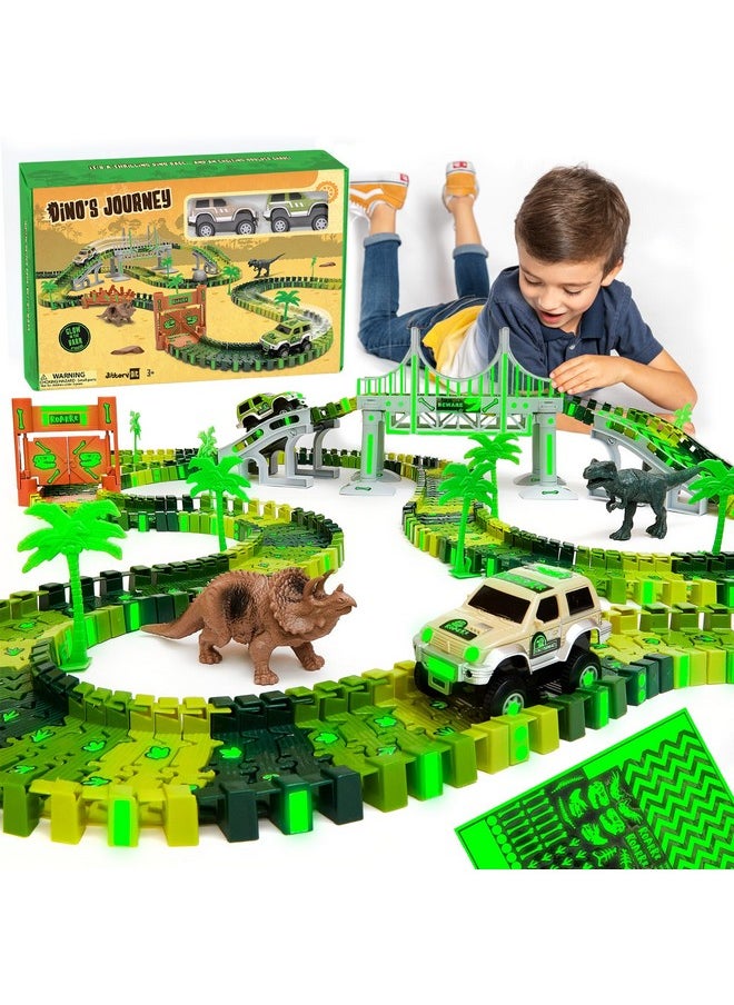 جيتيري جيت مجموعة ألعاب JITTERYGIT Dinosaur Jurassic Race Track Train المضيئة في العالم الداكن، حديقة سباق الديناصورات للأطفال تتضمن مجموعة لعب T-Rex وTriceratops - أفضل هدية عيد ميلاد للأولاد والبنات من سن 3 4 5 6 7 8 سنوات  - Image 1