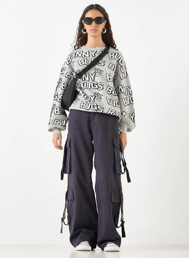 اس بي كاركترز كنزة بأكمام طويلة بتفاصيل باجز باني