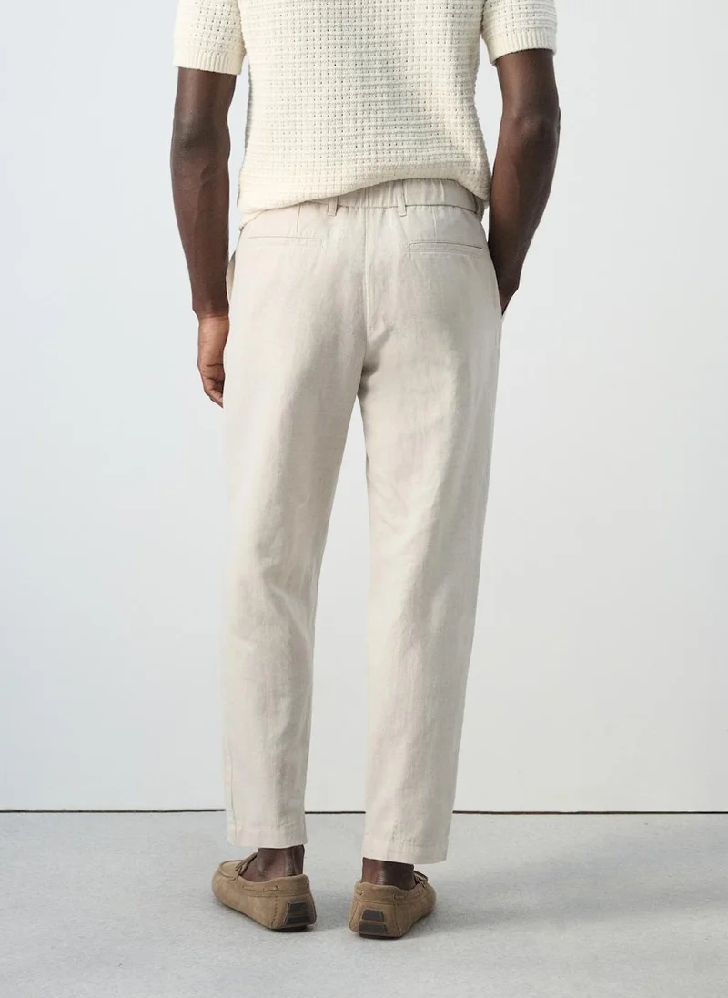 مانجو مان Slim fit cropped linen-cotton trousers
