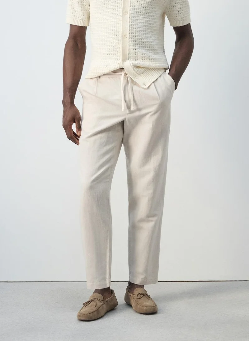 مانجو مان Slim fit cropped linen-cotton trousers