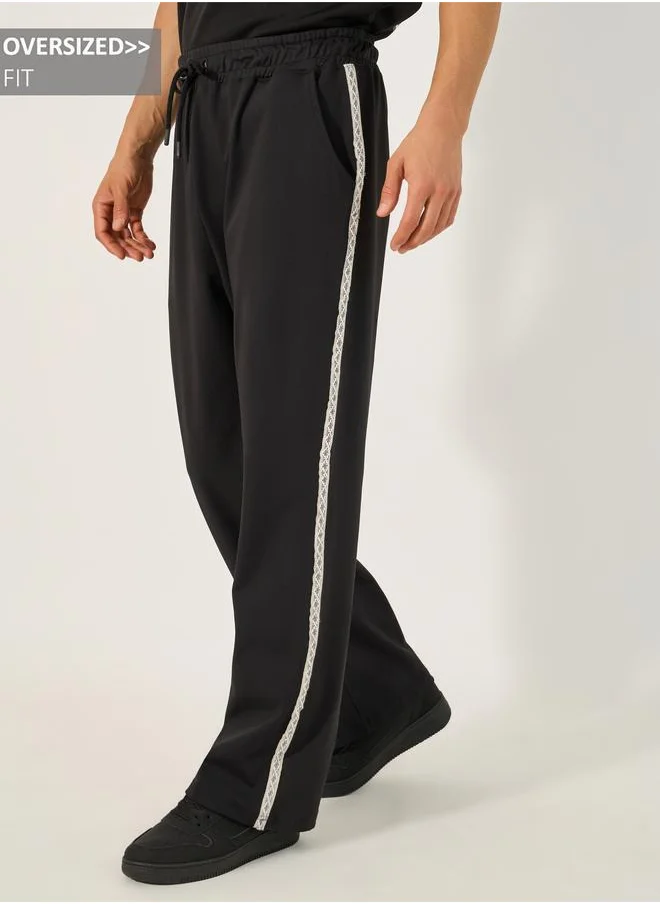 Styli Styli Oversized Mid Rise Drawstring Joggers with Side Jacquard Tape
