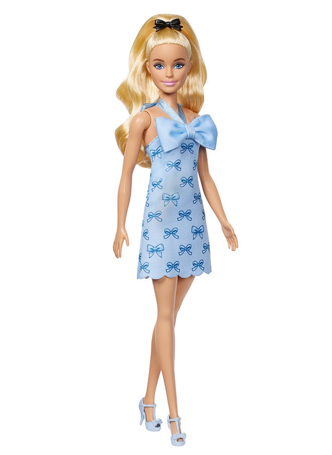 Barbie Fashionistas Doll #237 with Wavy Blonde Ponytail Wearing Blue Bow Halter Dress, Black Hair Bow Accessory and Matching Blue Heels  - Image 1