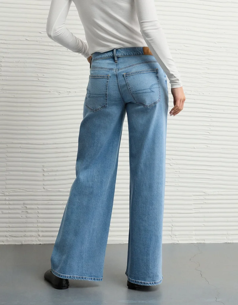 امريكان ايجل جينز مرن بخصر منخفض وساق واسعة للغاية بتفاصيل رقعات