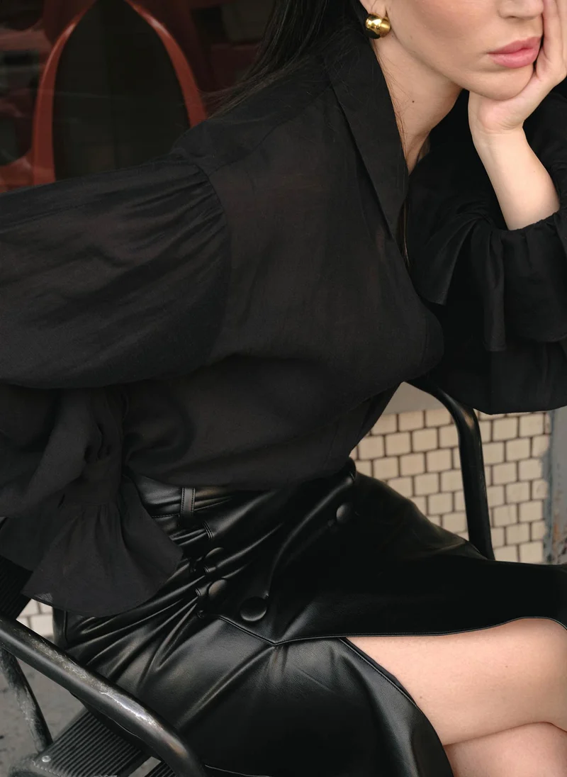 Lichi Fluffy blouse with flounces on the cuffs