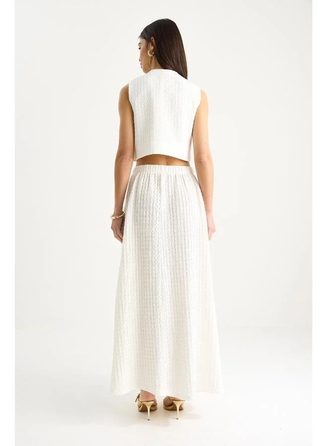 جينجر طقم بلوزة بدون أكمام وتنورة