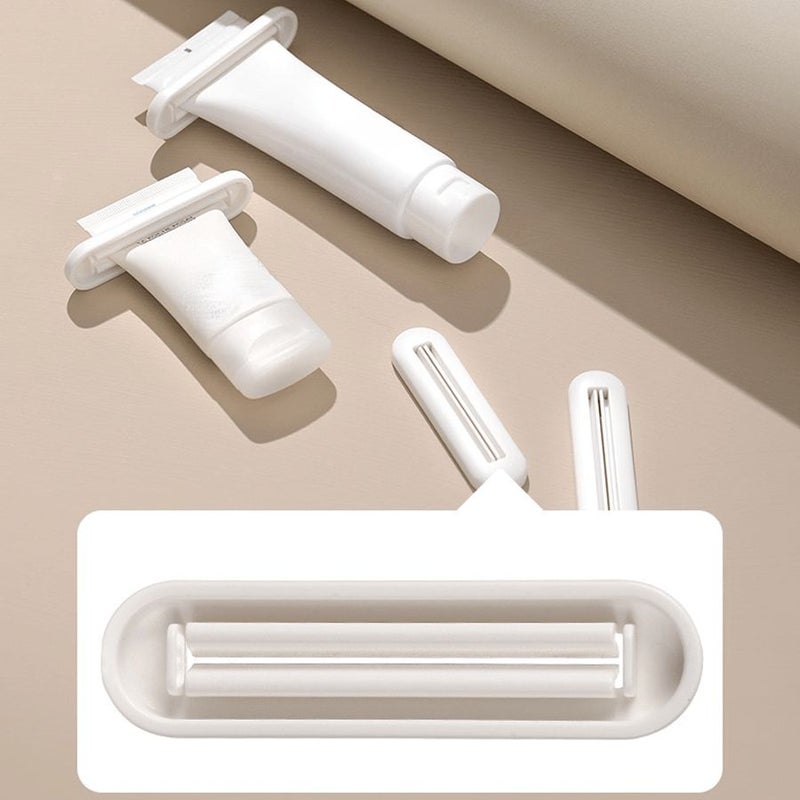 White Manual Toothpaste Squeezer 4pcs Bathroom Hand Cream Facial Cleanser Dispenser - Image 1