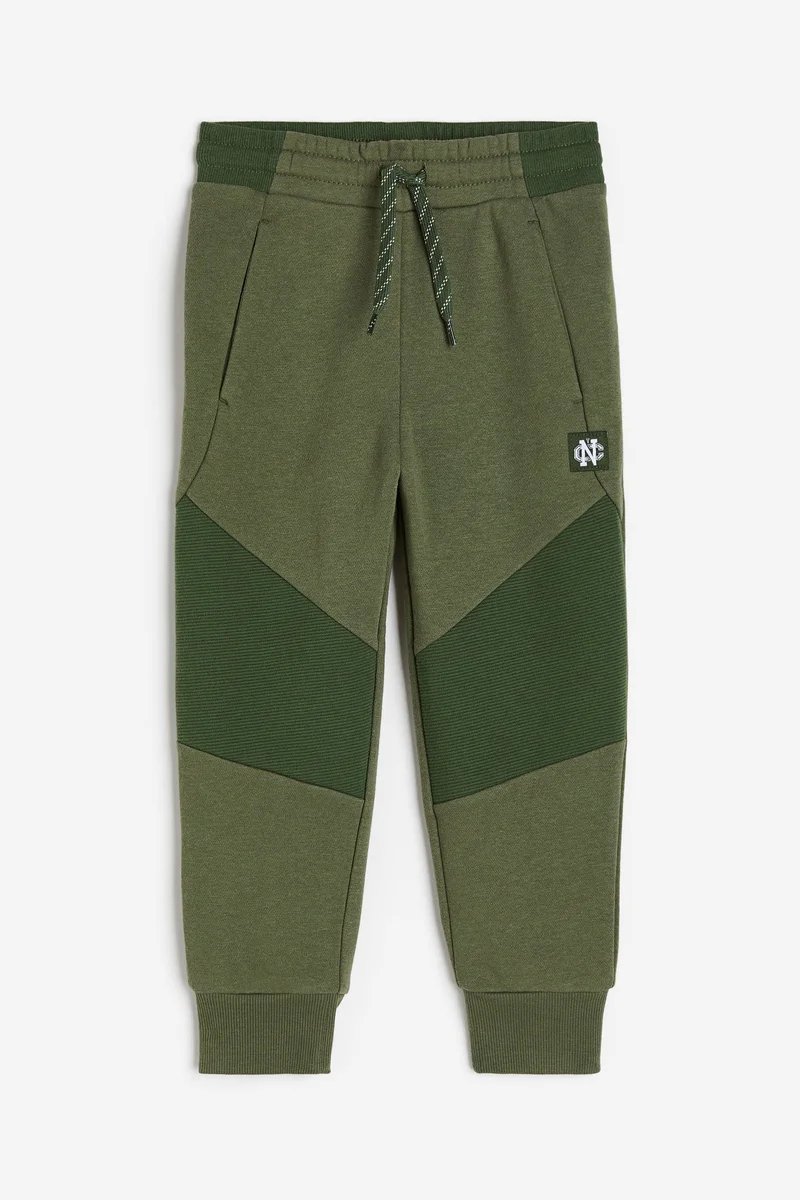 اتش اند ام بنطلون رياضي بجزء متين عند الركبة