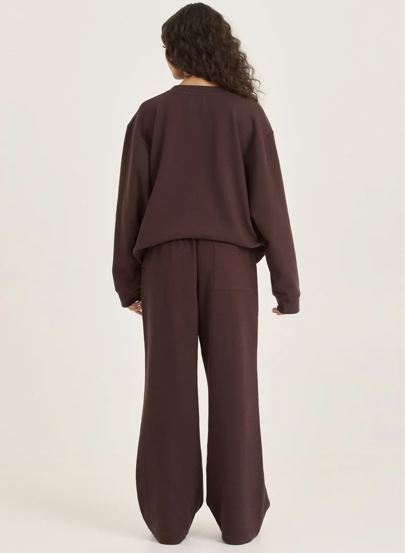 LOOM ARCHIVES  LOOM Waffle Wide Leg Trousers for Women | Best Price UAE