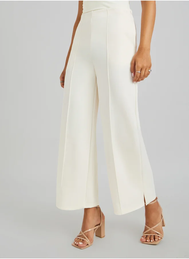 ستايلي Pin Tuck Detail Slit Hem Straight Knit Pants
