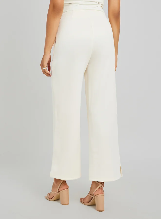 Styli Pin Tuck Detail Slit Hem Straight Knit Pants