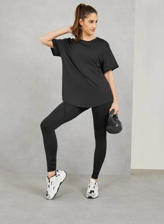 ستايلي اكتيف طقم رياضي: حمالة صدر رياضية بحمالات متقاطعة ونسيج شبكي من الخلف مع بنطلون ليجنز بتفاصيل خياطة (عبوة من 3)