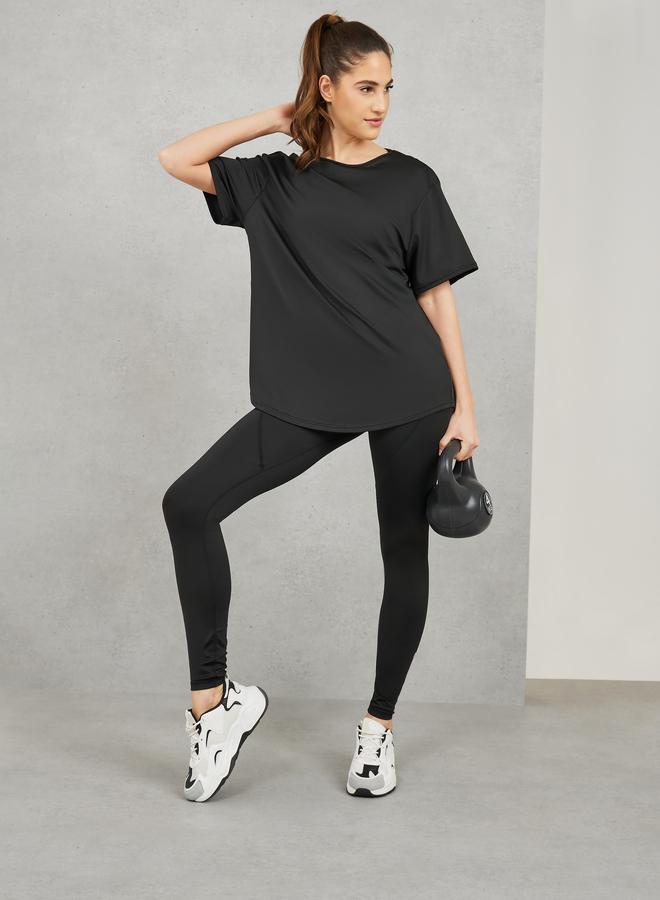 ستايلي اكتيف طقم رياضي: حمالة صدر رياضية بحمالات متقاطعة ونسيج شبكي من الخلف مع بنطلون ليجنز بتفاصيل خياطة (عبوة من 3) - Image 2