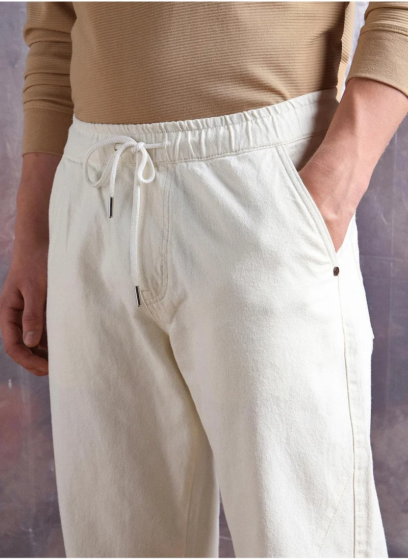 Hubberholme Ecru Straight Fit Jeans Washed design crafted from 100% Cotton with Elasticated closure.
