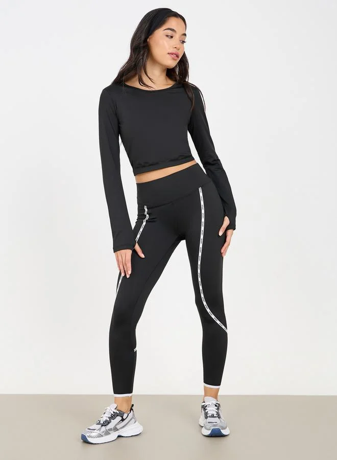 ستايلي Solid Crop Top with Thumbhole Detail with Side Striped Leggings Set
