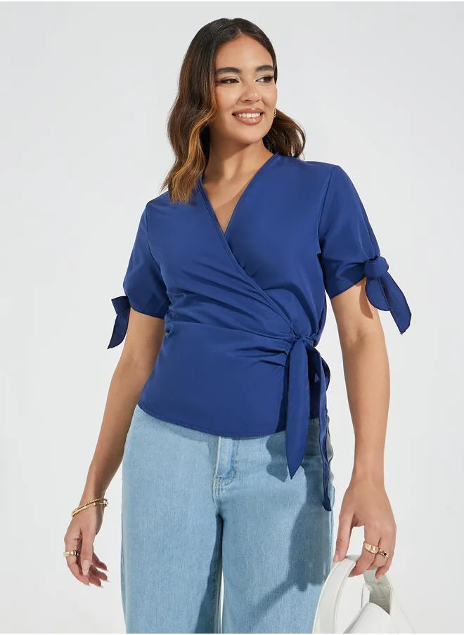 Styli Solid Wrap Top with Tie-Cuff Detail