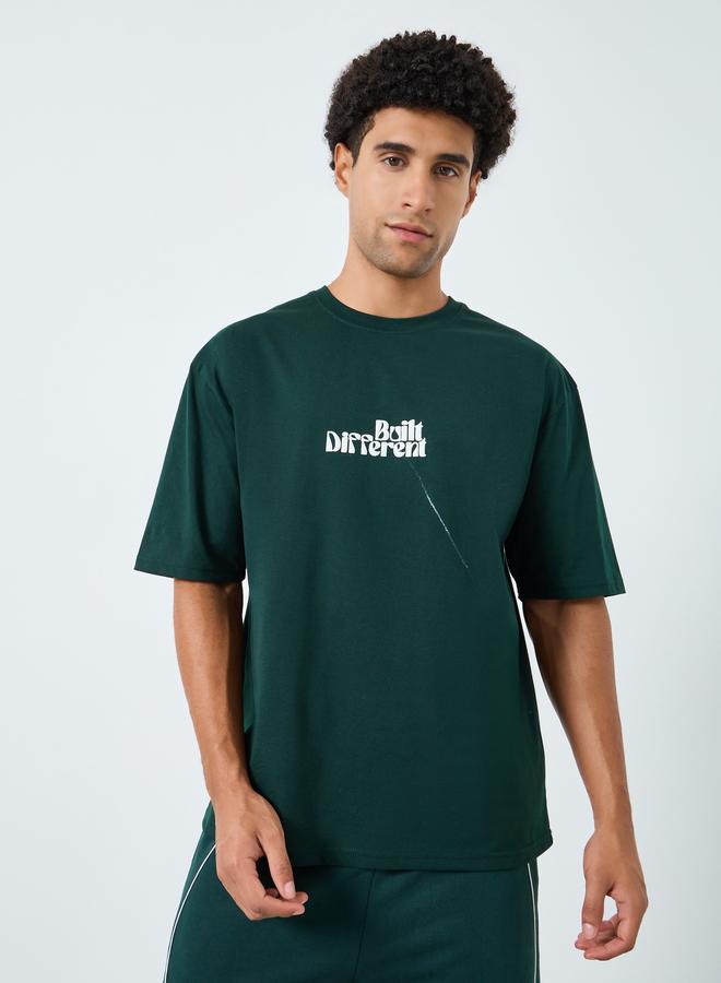 Styli Men Green Graphic Print Oversized T-Shirt - Image 1