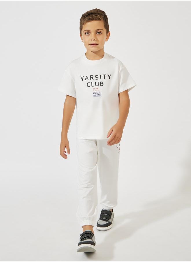 Varsity Print Oversized T-Shirt & Joggers Set - pzsku/Z16A1AEBA05E0F10EE57FZ/45/_/1724411130/50ba1a3e-b777-4078-9f4e-6b5c60aef55d