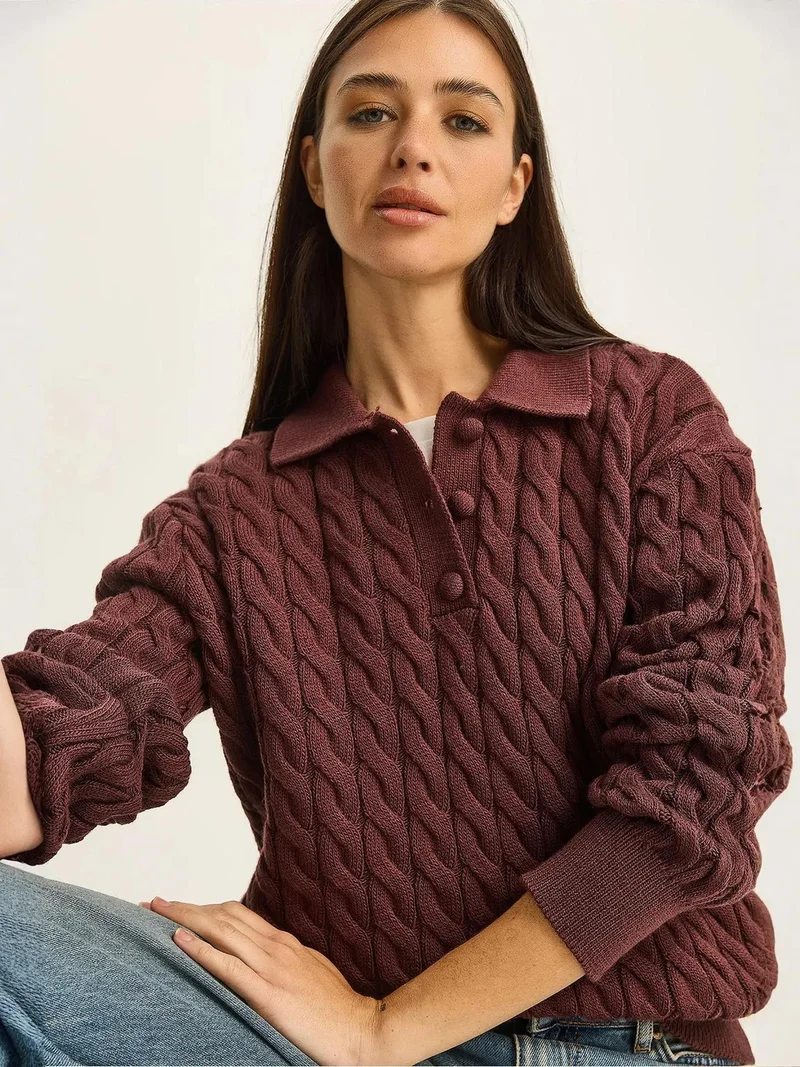 بيانكو لوتشي كنزة بولو برقبة سميكة بنقش ضفيرة من لوتشي