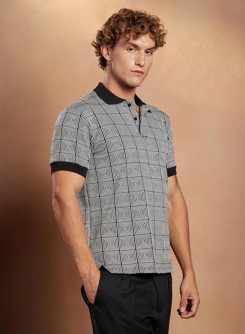 Campus Sutra Campus Sutra Men's Black & White Optical-Illusion Polo T-Shirt For Casual Wear | Polo Neck | Short Cuffed Sleeves | Half-Button Closure | T-Shirt Crafted With Comfort Fit For Everyday Wear