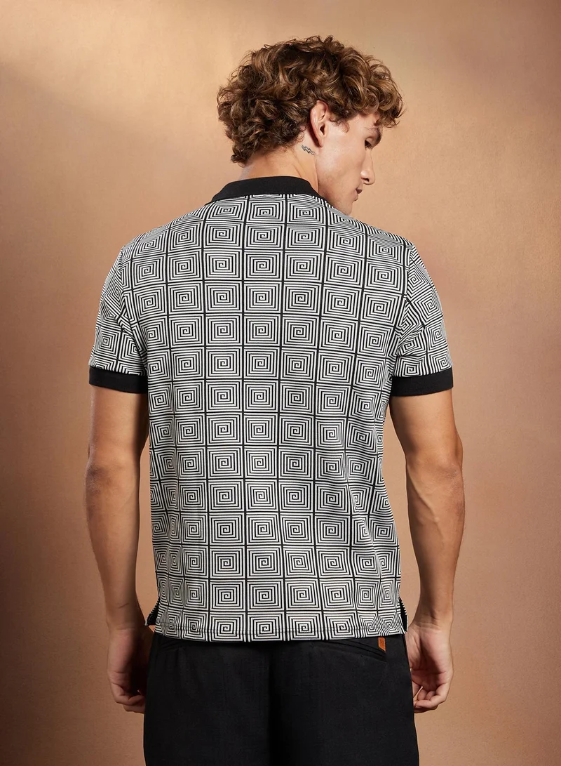 Campus Sutra Campus Sutra Men's Black & White Optical-Illusion Polo T-Shirt For Casual Wear | Polo Neck | Short Cuffed Sleeves | Half-Button Closure | T-Shirt Crafted With Comfort Fit For Everyday Wear