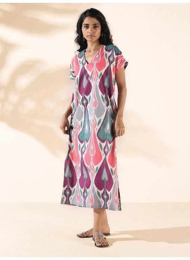 ترو برونز فستان قطن أخضر بطبعة إيكات وشق من