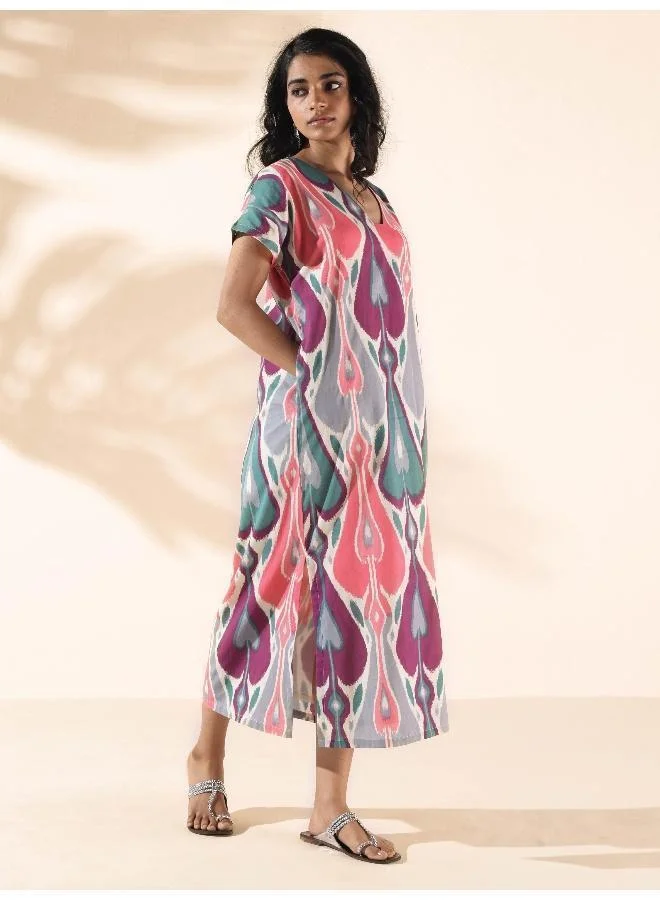 ترو برونز فستان قطن أخضر بطبعة إيكات وشق من