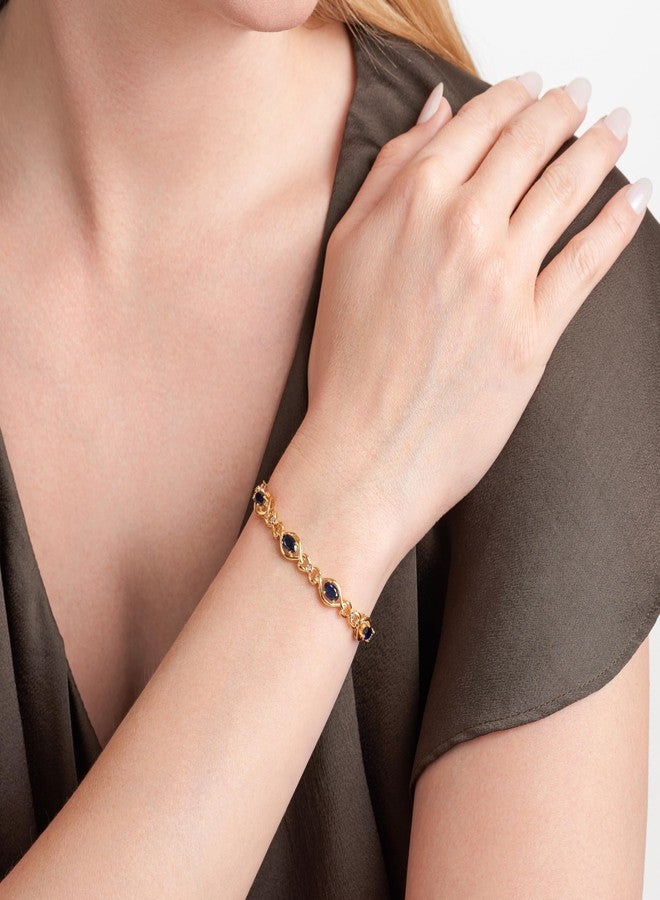 مورجان آند بايدج سوار تنس نسائي من مورغان آند بيج، مصنوع من الفضة الإسترليني عيار 925 ومطلي بالذهب الأصفر عيار 18 قيراطًا، مرصع بأحجار الياقوت الأزرق والأبيض - سوار أنيق بتصميم مفتوح مستوحى من رمز اللانهاية، طوله 7.25 بوصة - Image 2