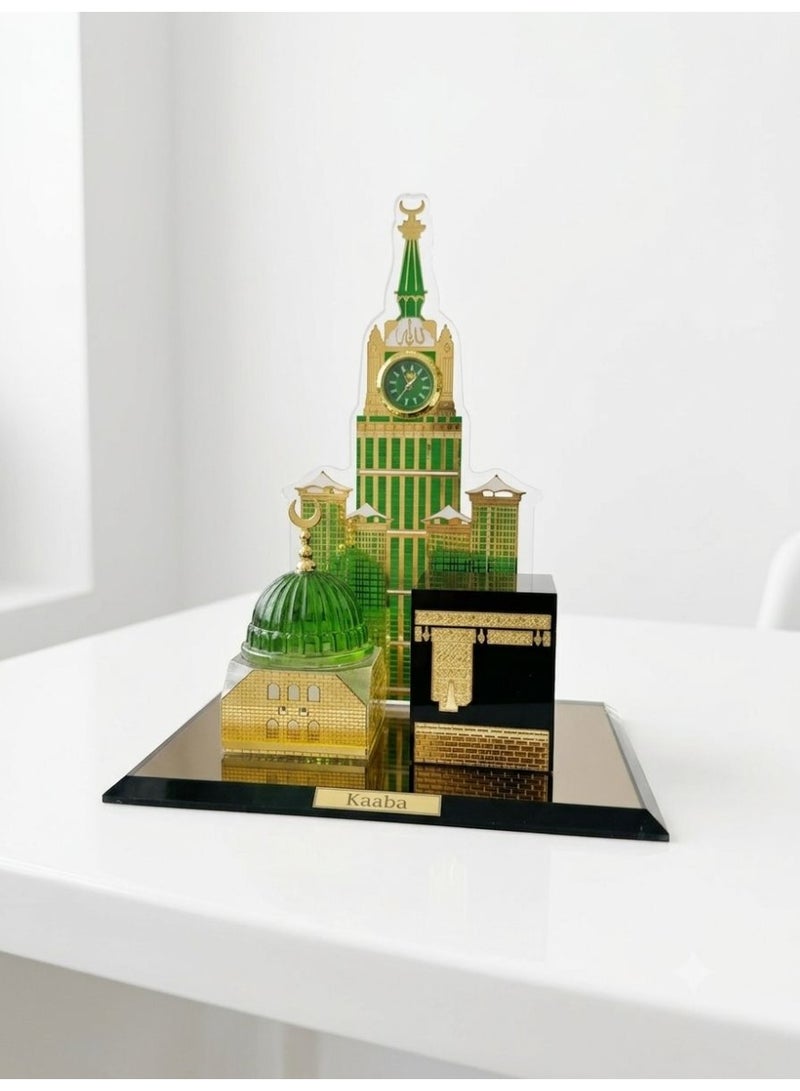 A luxurious work of art crafted from high-quality crystal glass, this piece features a model of the Holy Kaaba and the Prophet's Mosque (Al-Rawdah Al-Sharifah) with an elegantly designed clock tower. It adds a distinctive spiritual touch to living rooms, offices, and shelves. The model measures 15 x 11 cm, and the clock tower is 16 cm tall. It comes in a gift-ready box. - Image 2