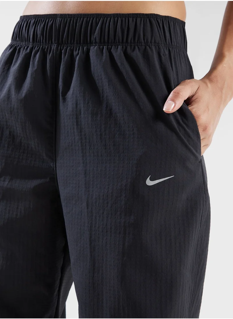 نايكي 7/8 بنطال رياضي دافئ متوسط الارتفاع من Fast Dri-Fit