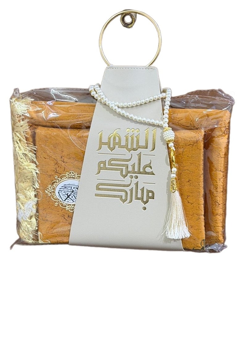 A prayer rug, a Quran, and prayer beads, presented with a suitable strap, as a Ramadan gift. - Image 2