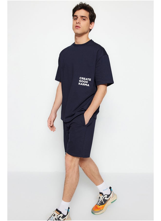 trendyol Navy Blue Tracksuit Relaxed/Comfortable Cut Text Printed Cotton TMNSS23EM00001  - Image 1