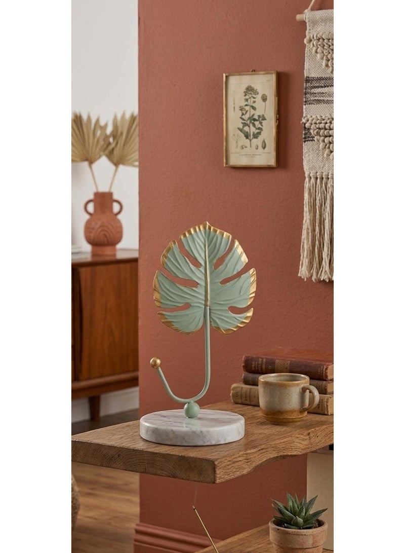Metal jewelry and key holder with a monstera leaf design - pastel green with gold trim and a round marble base - modern table decoration - Image 1