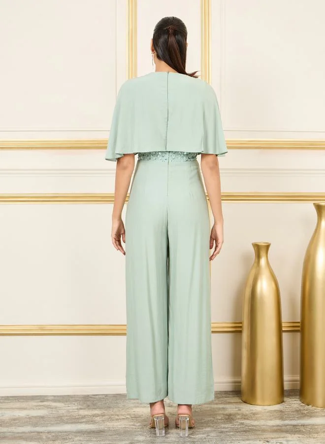 ستايلي Embellished Cape Sleeves Wide Leg Jumpsuit