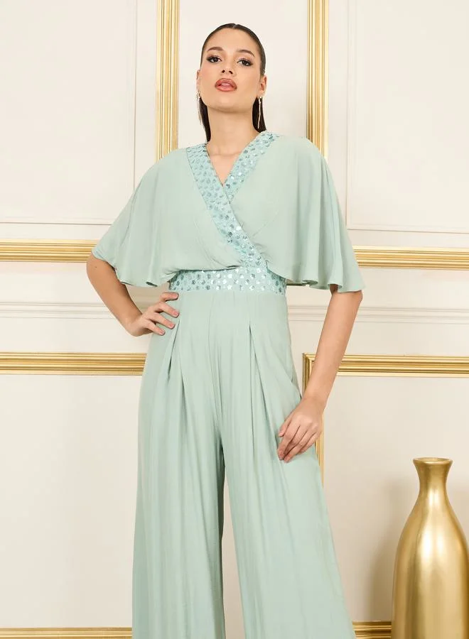 ستايلي Embellished Cape Sleeves Wide Leg Jumpsuit