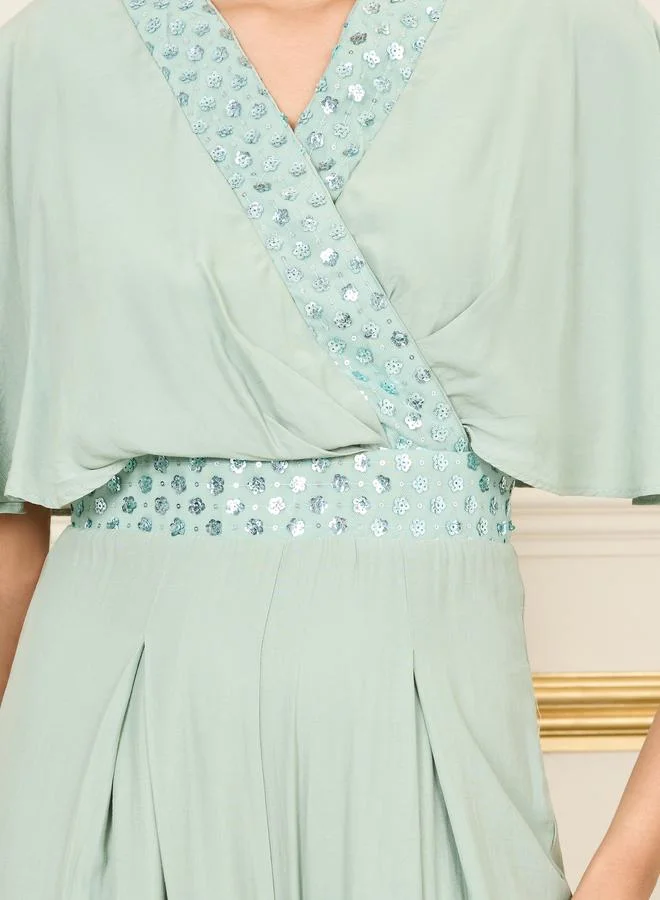 ستايلي Embellished Cape Sleeves Wide Leg Jumpsuit