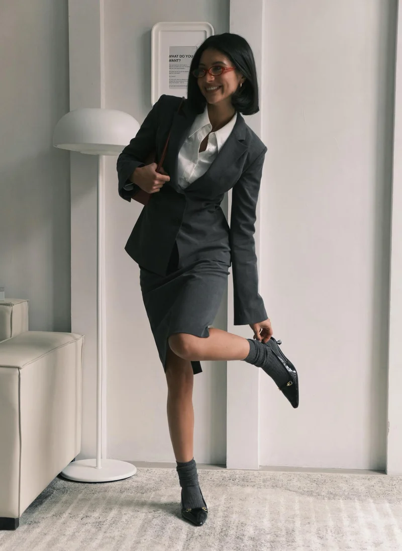 Lichi Knee-length mini skirt with imitation side pockets and a belt