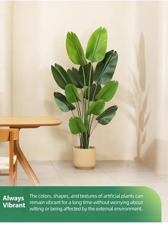 Artificial Bird of Paradise Plant: A faux palm tree perfect for indoor or outdoor modern decoration. It comes in a pot, making it an ideal housewarming gift for home or office. - https://f.nooncdn.com/p/pzsku/Z173FE3B6719612E5C937Z/45/_/1705288804/bc9a8d02-2cba-4d3a-9901-c396c91c52b7.jpg?width=original