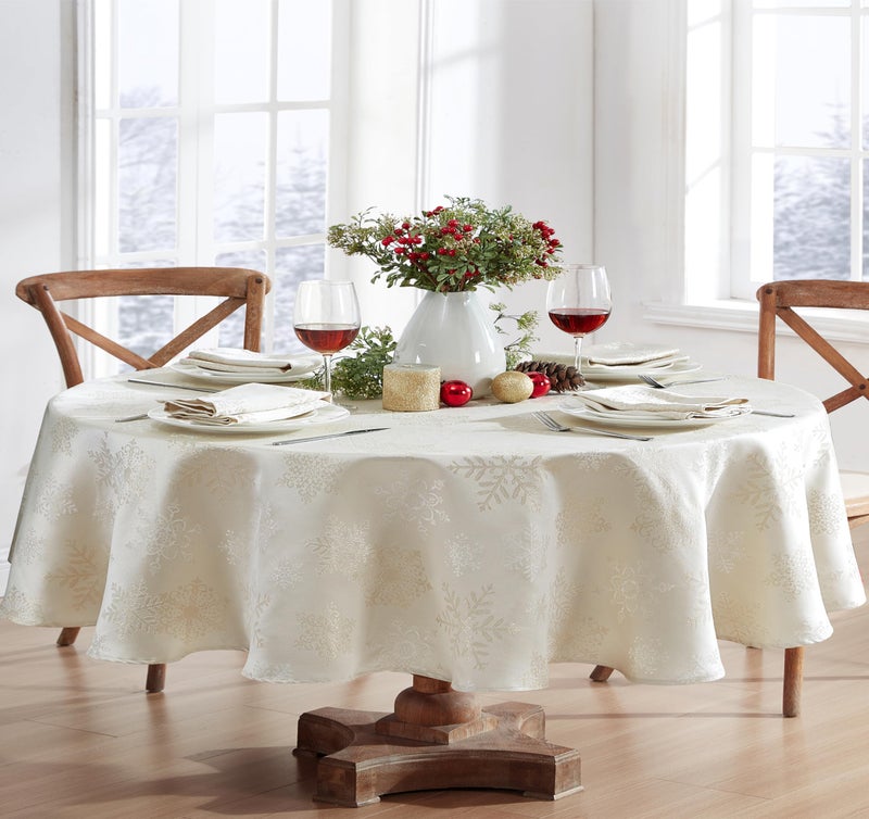 Newbridge Fancy Metallic Snowflake Christmas Fabric Tablecloth 60 x 84 Inch Oval Ivory Gold NoIron Soil Resistant Sparkling Snowflakes Woven Holiday Table Cover
