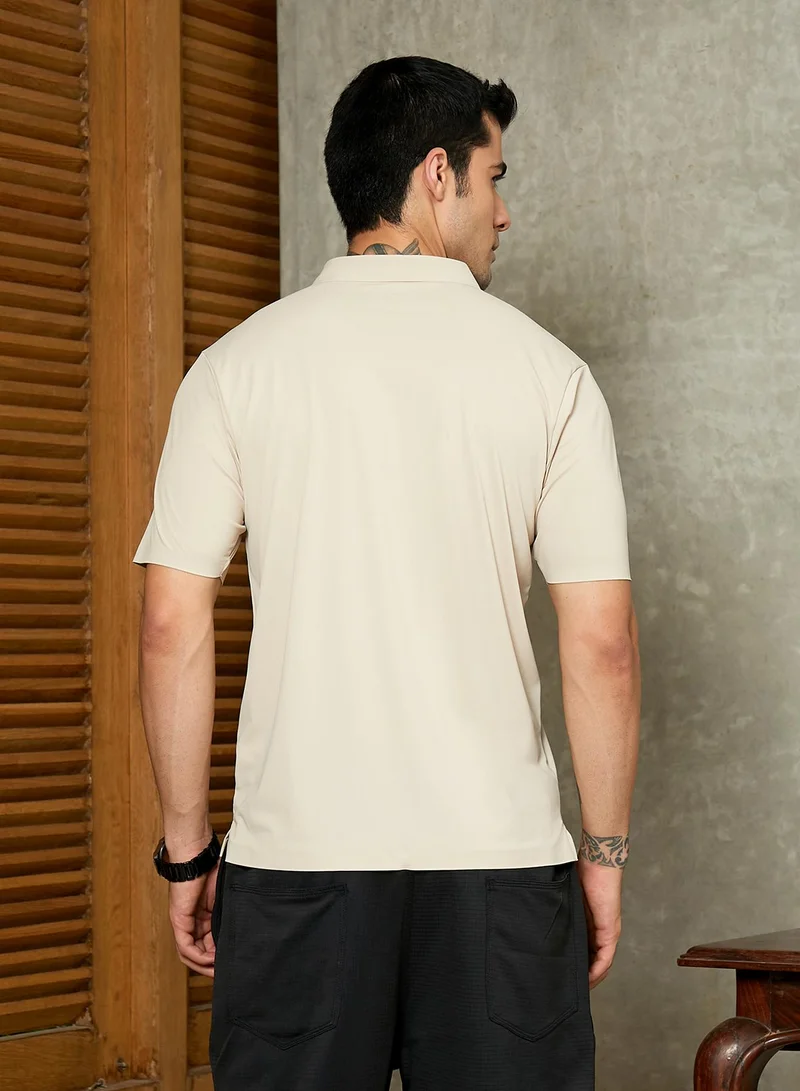 Campus Sutra Campus Sutra Men's Saltbox Beige Seamless Solid Polo T-Shirt For Casual Wear | Polo Neck | Short Regular Sleeves | Button Closure | T-Shirt Crafted With Comfort Fit For Everyday Wear