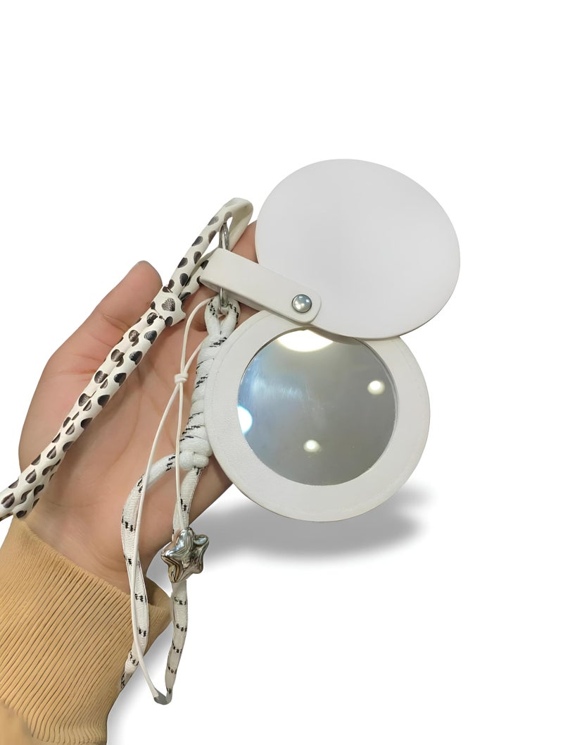 Leather - Stylish handheld mirror with ultra-clear glass surrounded by durable artificial leather frame and a snap closure guard ensuring long-lasting pristine condition. (option 2) - Image 1