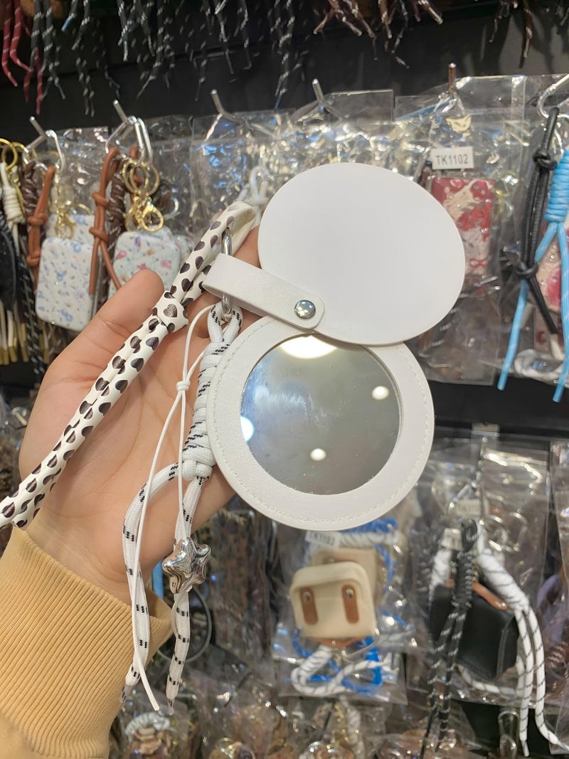 Leather - Stylish handheld mirror with ultra-clear glass surrounded by durable artificial leather frame and a snap closure guard ensuring long-lasting pristine condition. (option 2) - Image 2