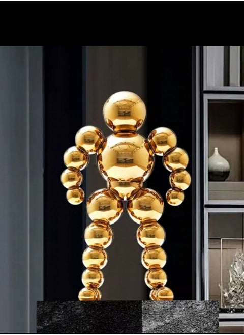 Golden Spherical Man Statue - A Modern Artwork That Attracts Eyes