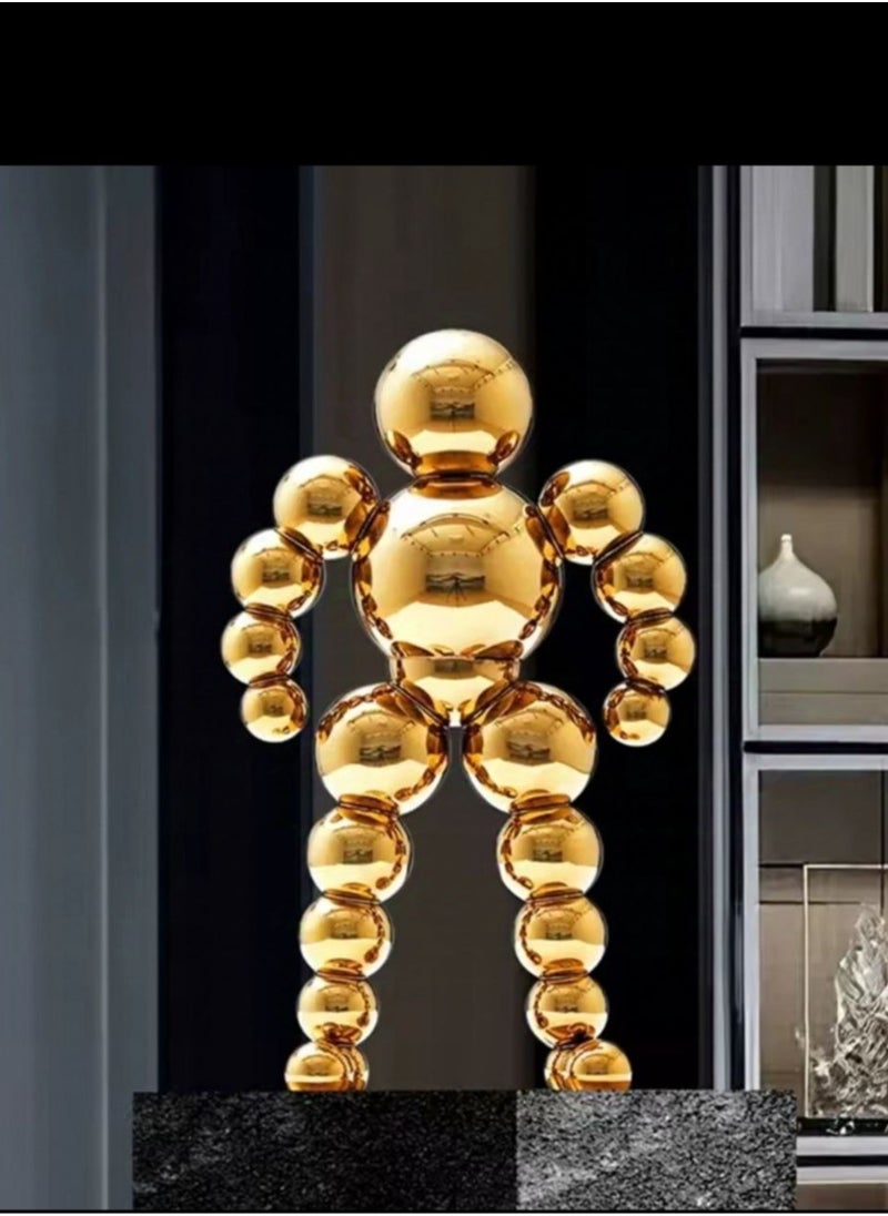 Golden Spherical Man Statue - A Modern Artwork That Attracts Eyes