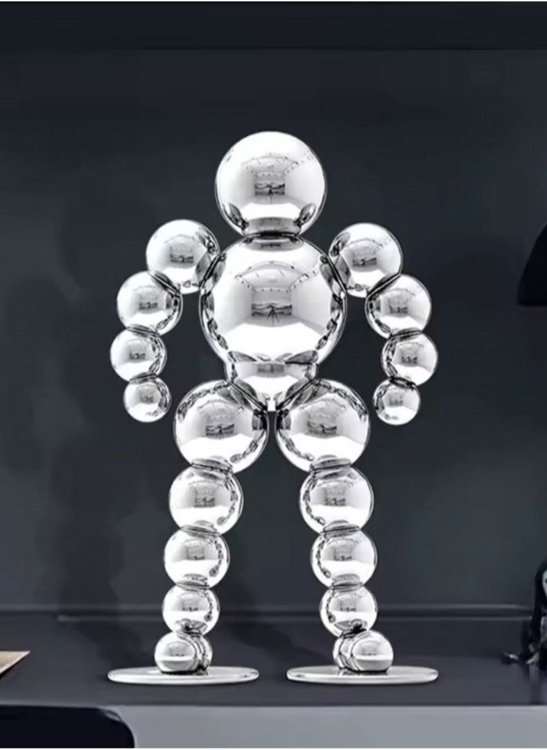 Golden Spherical Man Statue - A Modern Artwork That Attracts Eyes