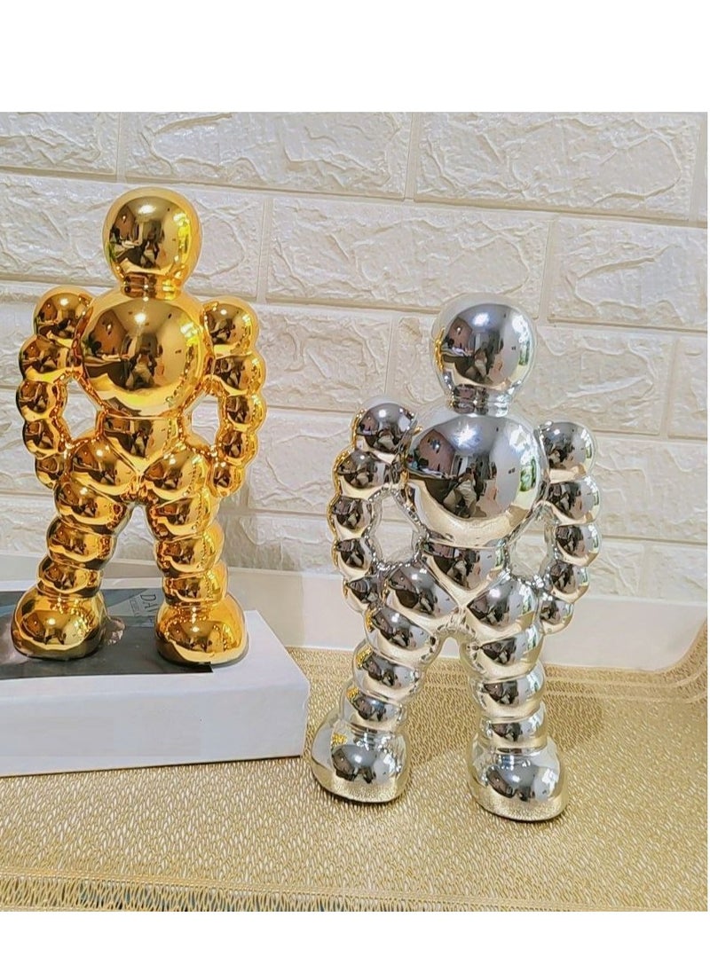 Golden Spherical Man Statue - A Modern Artwork That Attracts Eyes