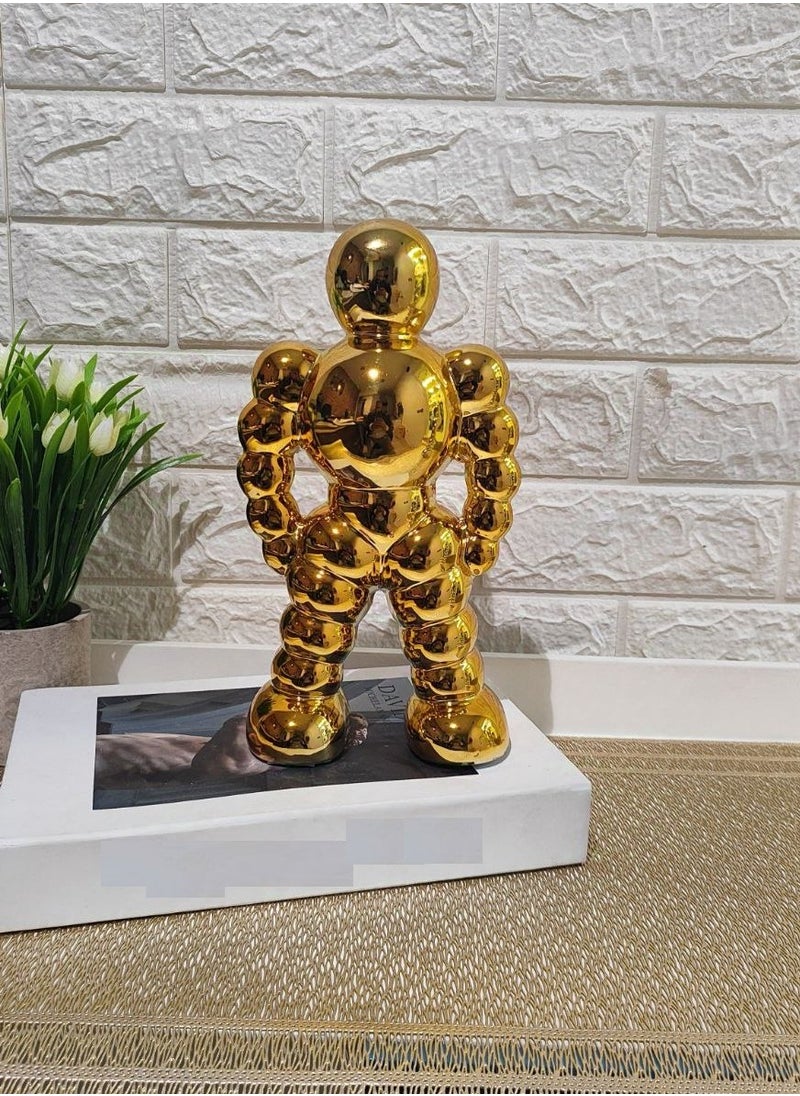 Golden Spherical Man Statue - A Modern Artwork That Attracts Eyes