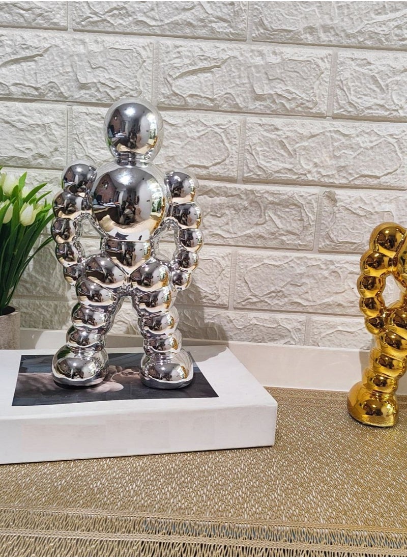 Golden Spherical Man Statue - A Modern Artwork That Attracts Eyes