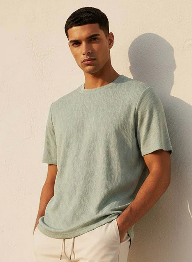 ايكونيك Iconic Men Regular Fit Crew Neck Short Sleeves Textured T-shirt