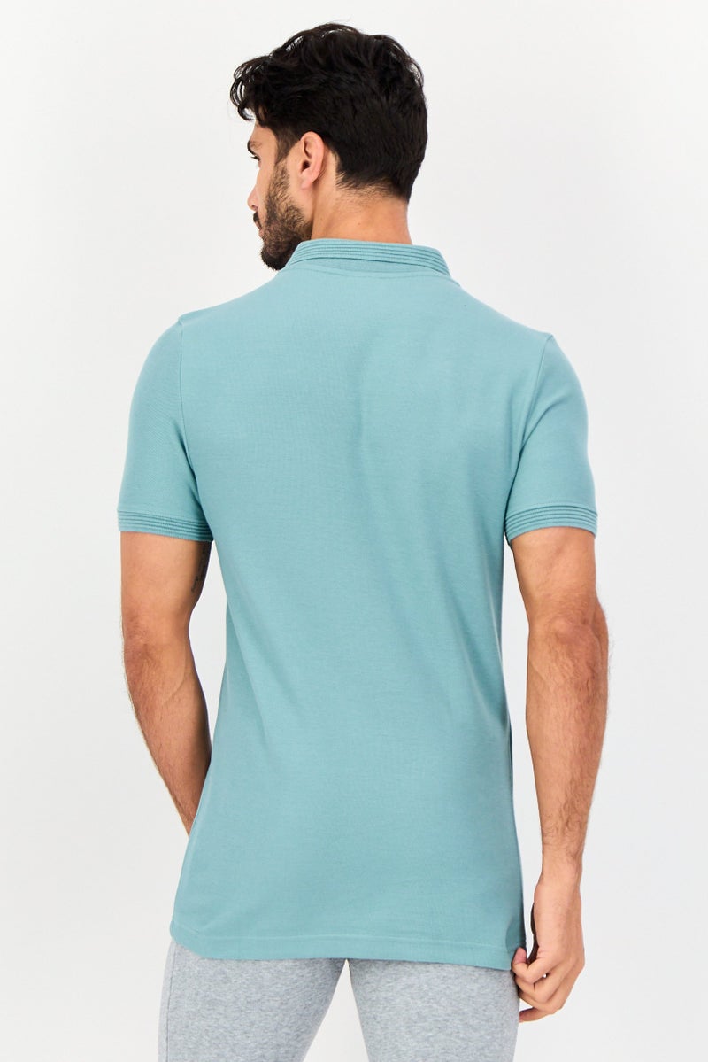 PUMA قميص بولو خارجي بأكمام قصيرة للرجال بتصميم ضيق مع شعار مطرز، أزرق بحري - Image 4