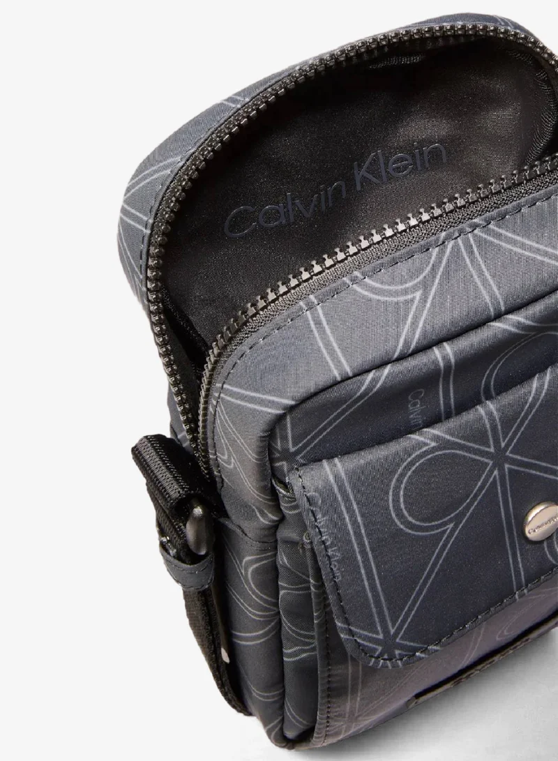 Calvin Klein Pirate Black Printed Logo Reporter Bag for Men | Best Price UAE